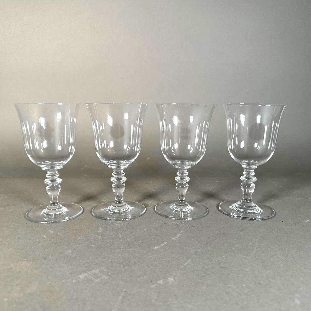 Four Baccarat Provence Pattern Crystal Water Goblets: Four Baccarat Provence Pattern Crystal Water Goblets, flared rim bowls on baluster standards, Baccarat acid stamps. Provenance: Charles Phillips Collection, Cleveland, Ohio. Dimensions: 6.25 in.h. Con