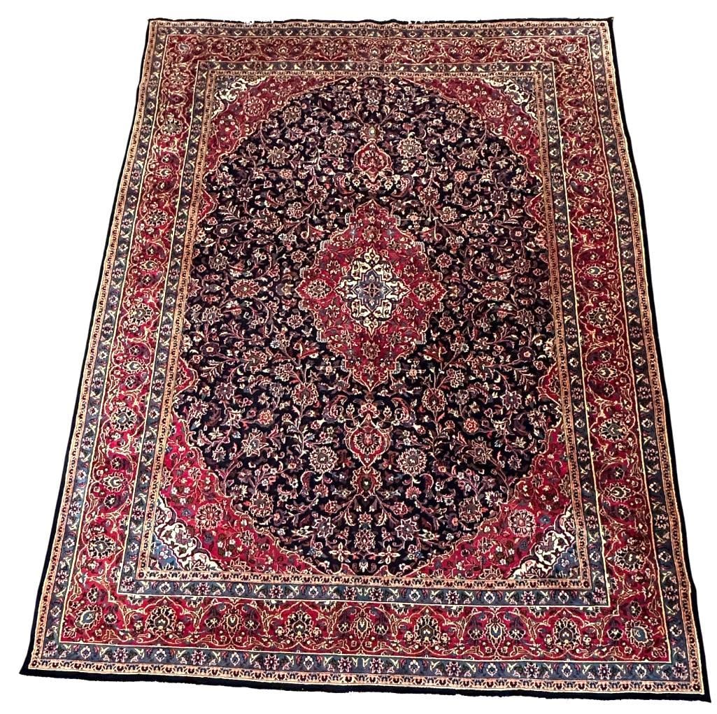 Blue Isphahan Carpet 12'6" x 9'6": Blue shaped field with red corner guards and red border, short fringe ends, measures 12'6" x 9'6".