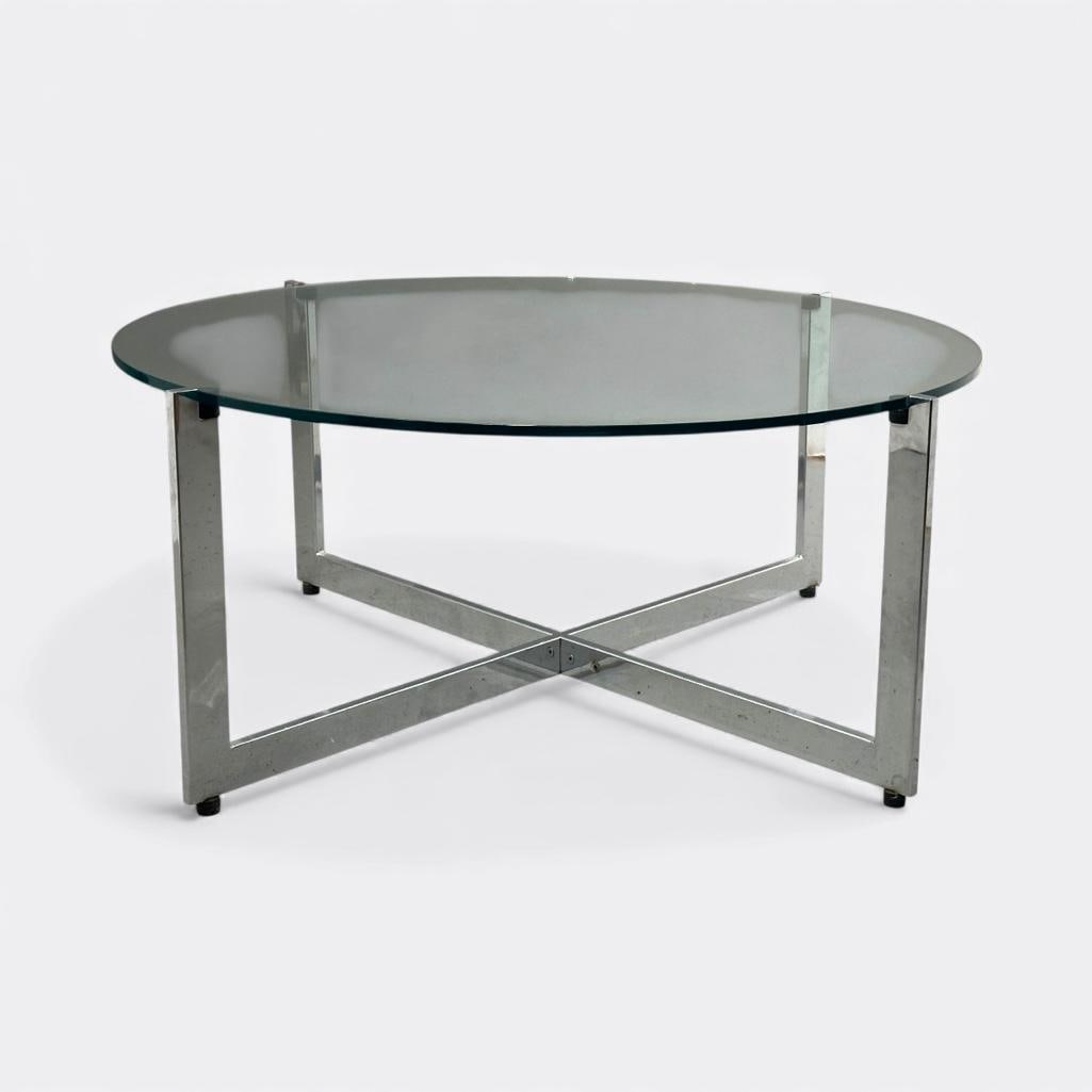 Attributed, Milo Baughman, Glass and Chrome Coffee Table: Attributed, Milo Baughman, chrome base coffee table with round, clear glass top. Measures apprx 18"T x 40.5"D. Condition: