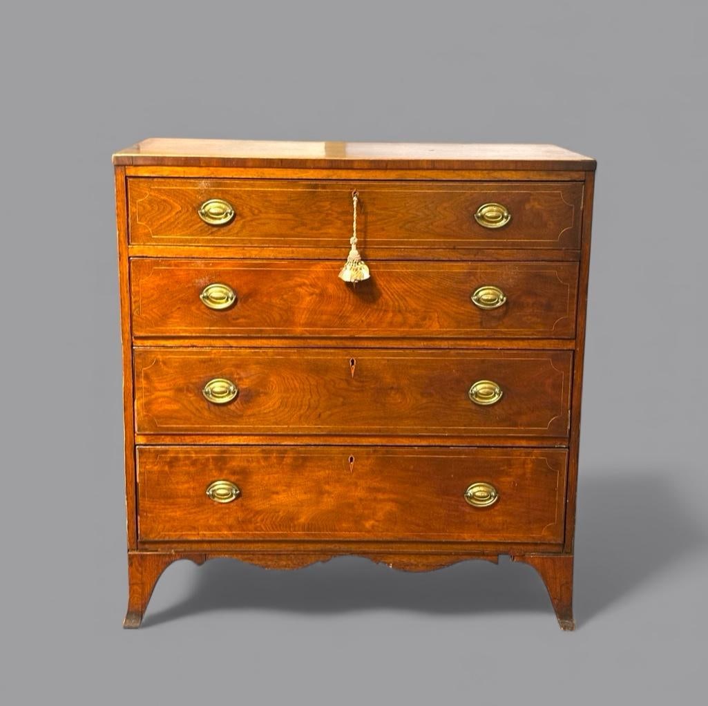 English George III Mahogany Chest of Drawers: English George III Mahogany Chest of Drawers, c.1800, the rectangular top over four graduated long drawers, line inlaid with satinwood, raised on splayed feet. Dimensions: 40 in.h. x 38 in.w. x 19.5 i
