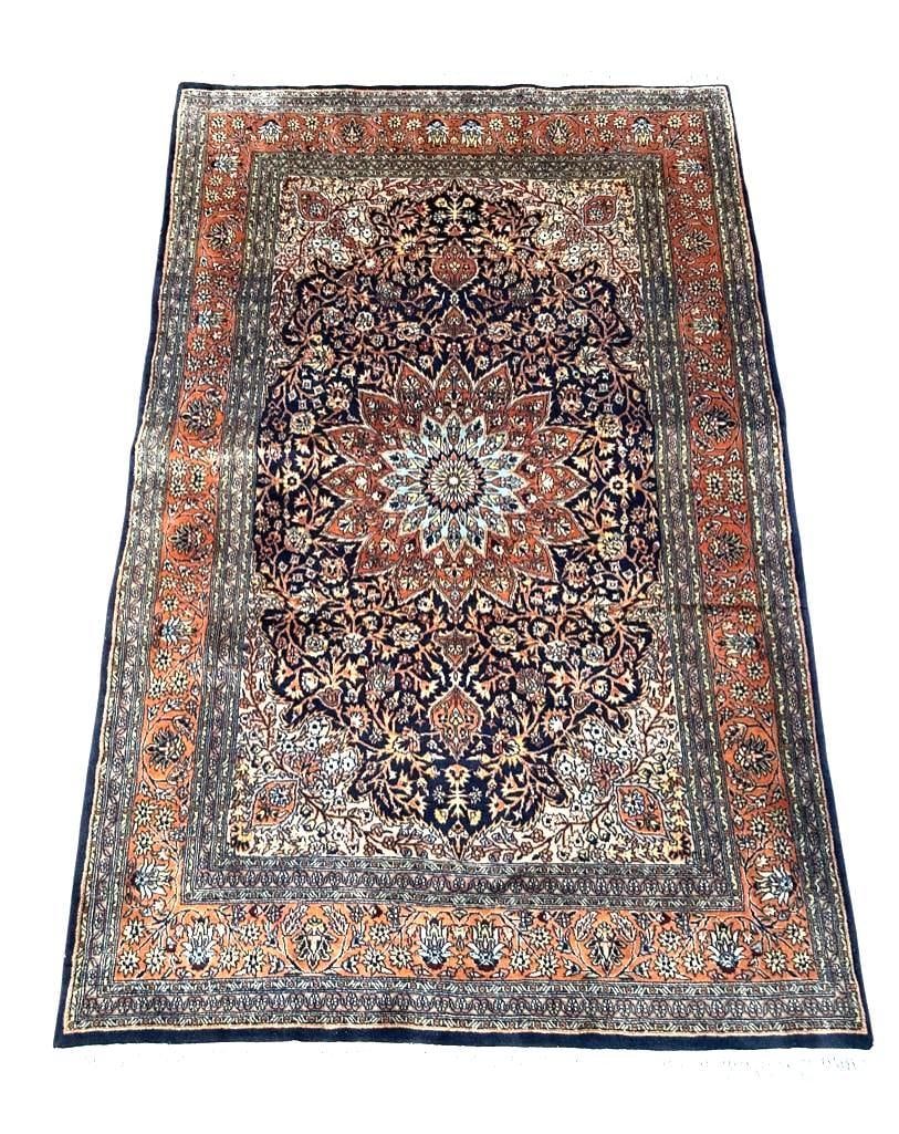 Persian Wool Carpet, Tabriz, 7'3 x 4'7": Persian Wool Carpet, Tabriz, central star medallion in pale blue on intricate floral scroll over a navy field , with burnt orange borders and a floral vine scroll. Cotton foundation with knotted fring