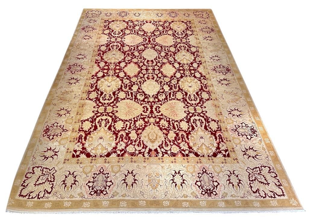 Large Indian Wool Carpet, 18'4 x 12': Large Indian Hand Knotted Wool Carpet, c. 1980's, Stylized palmettes in tan on a red center field with a reverse border in tan, pink, pale wheat yellow and red. Dimensions: 18'4 x 12' Cond