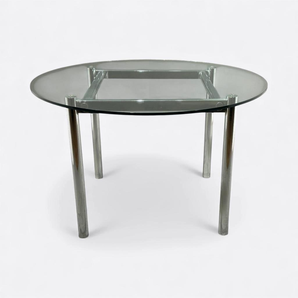 Attributed, Milo Baughman, Chrome and Glass Dining Table: Attributed, Milo Baughman, chrome base dining table with round, clear glass top. Measures apprx 29"T x 46"D. Condition: good, metal with some spots.