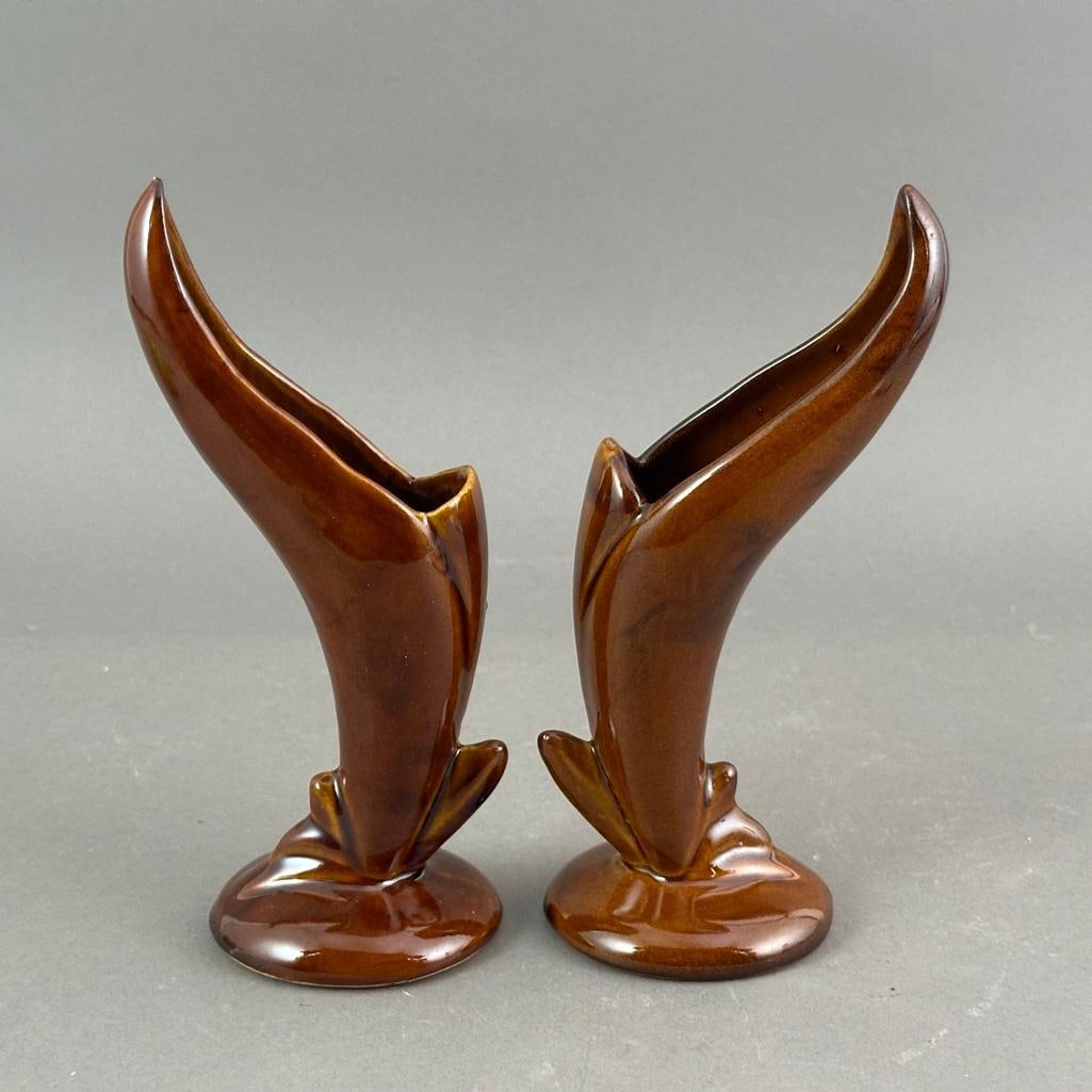 Pair of Van Briggle Spill Vases: Brown glaze on ceramic, spill vases of organic form, on round foot. The bottoms incised with the Colorado Springs mark and finisher's letter. Apprx 9"T. Condition: excellent, no damage or