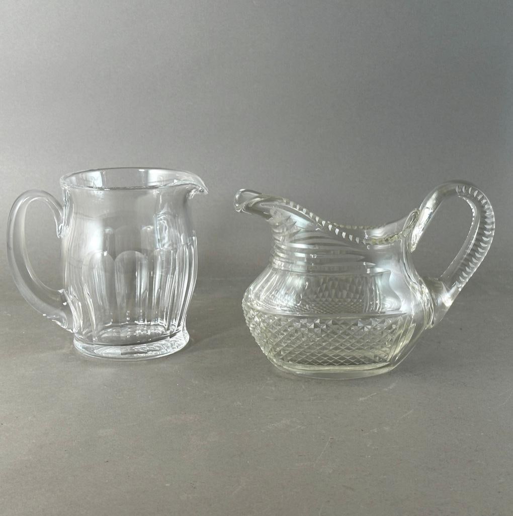 Antique Anglo-Irish Cut Glass Pitcher and Waterford Kathleen Jug: Antique Anglo-Irish Cut Glass Pitcher and Waterford Kathleen Jug. The Anglo-Irish pitcher of squat form with applied scroll hand;e, cut with cross hatching and ovals, together with a Waterford