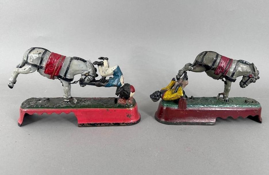 Two "I Always Did Spise a Mule" Cast Iron Mechanical Banks: Two "I Always Did Spise a Mule" Cast Iron Mechanical Banks, Bench Version, and Jockey version, J.& E. Stevens Company, Cromwell, CT, c.1880's. Dimensions: 6 in.h. x 10 in.l. x 3