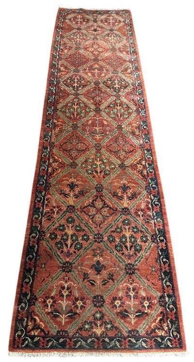 Wool Runner 9'8" x 2'4": Wool on cotton foundation, dusty rose ground color with plum, green, cream, tan, teal accent colors; Garden panel design, short fringe at one end, thick soft wool. Apprx 9'8" x 2'4".