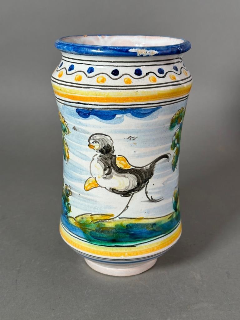 Continental Tin Glazed Albarello: Continental Tin Glazed Albarello, decorated with a rabbit and a bird in cobalt blue, green, yellow and black glazes, signed to base. Dimensions: 8.5 in.h. Condition: Some old chips.