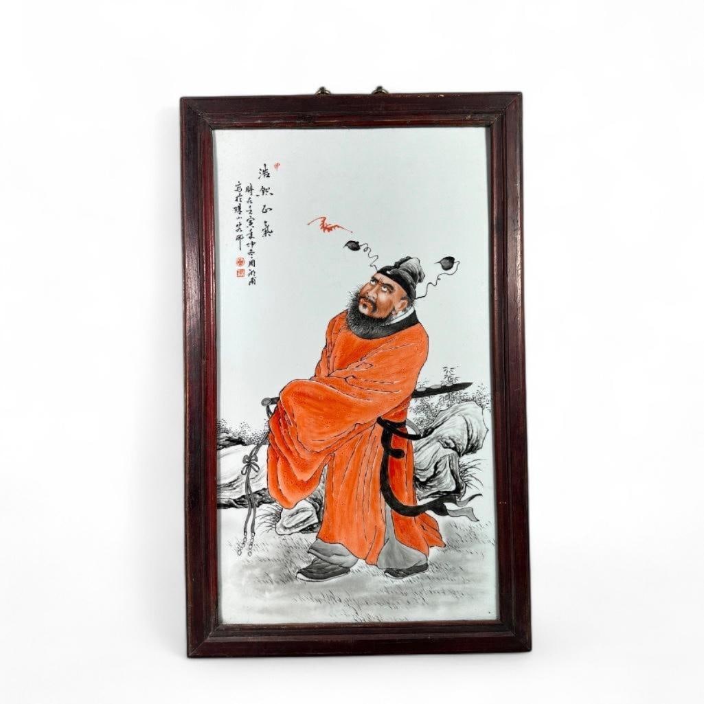 Chinese Pictorial Plaque of Zhong Kui: Chinese enamel on porcelain plaque, depicting the Demon Hunter Zhong Kui. Depicting in a bright red robe, always with a fierce expression looking up at a small bat, as he is associated with the five