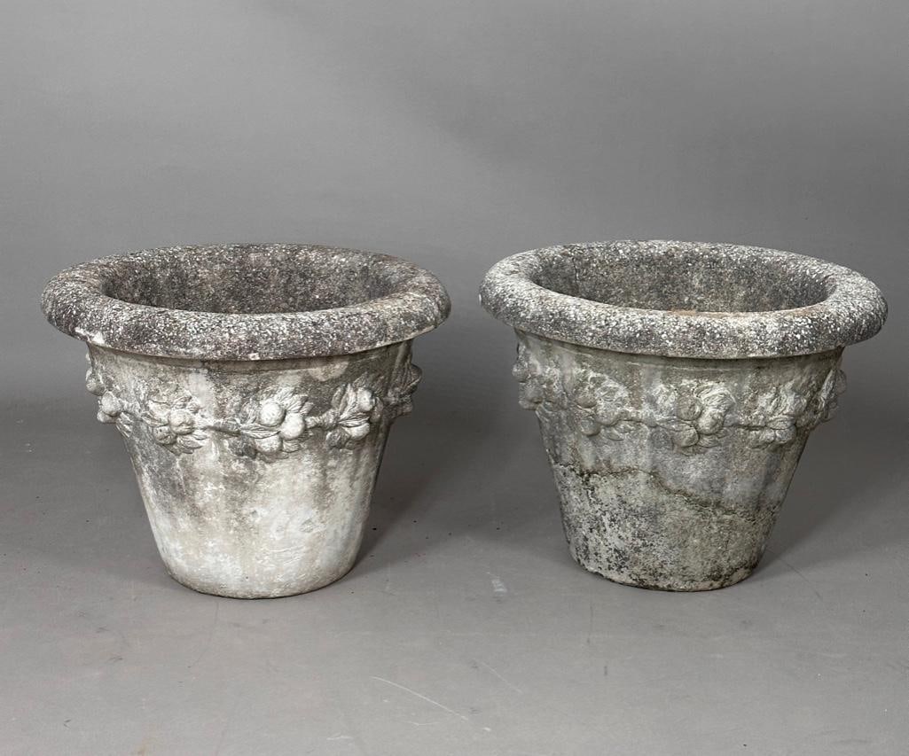 Pair of Cast Concrete Garden Planters: Pair of Cast Concrete Garden Planters, tapering forms with foldover rims cast with fruiting vines. Dimensions: 16 in.h. x 20.5 in. dia. Condition: Good with nice outdoor wear and patina.