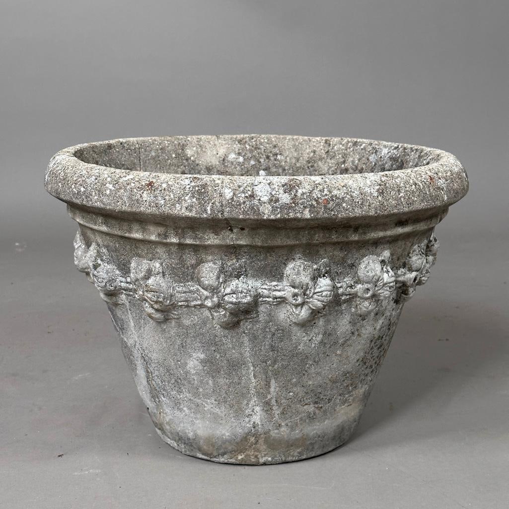 Single Cast Concrete Garden Planter: Single Cast Concrete Garden Planter, tapering form with foldover rim cast with fruiting vines. Dimensions: 11 in.h. x 16 in. dia. Condition: Good with nice outdoor wear and patina.