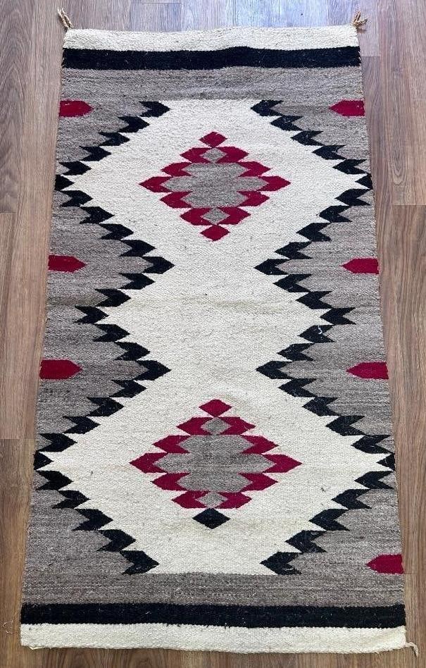 Navajo Woven Wool Carpet, 4'9 x 2'6: Navajo Woven Wool Carpet, with center geometric pattern in cream, red and natural wool. Dimensions: 4'9 x 2'6 Condition: Very good.