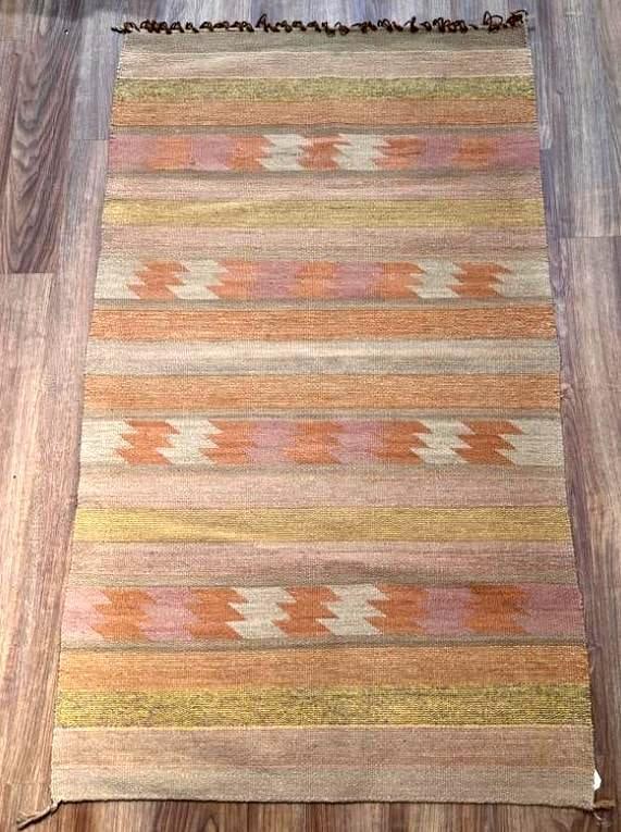 Navajo Woven Wool Carpet, Chinle, 4'11 x 2'11: Navajo Woven Wool Carpet, Chinle, horizontal registers with geometric designs in sandy colors, loop fringe at one end. Dimensions: 4'11 x 2'11 Condition: Very good vintage condition.