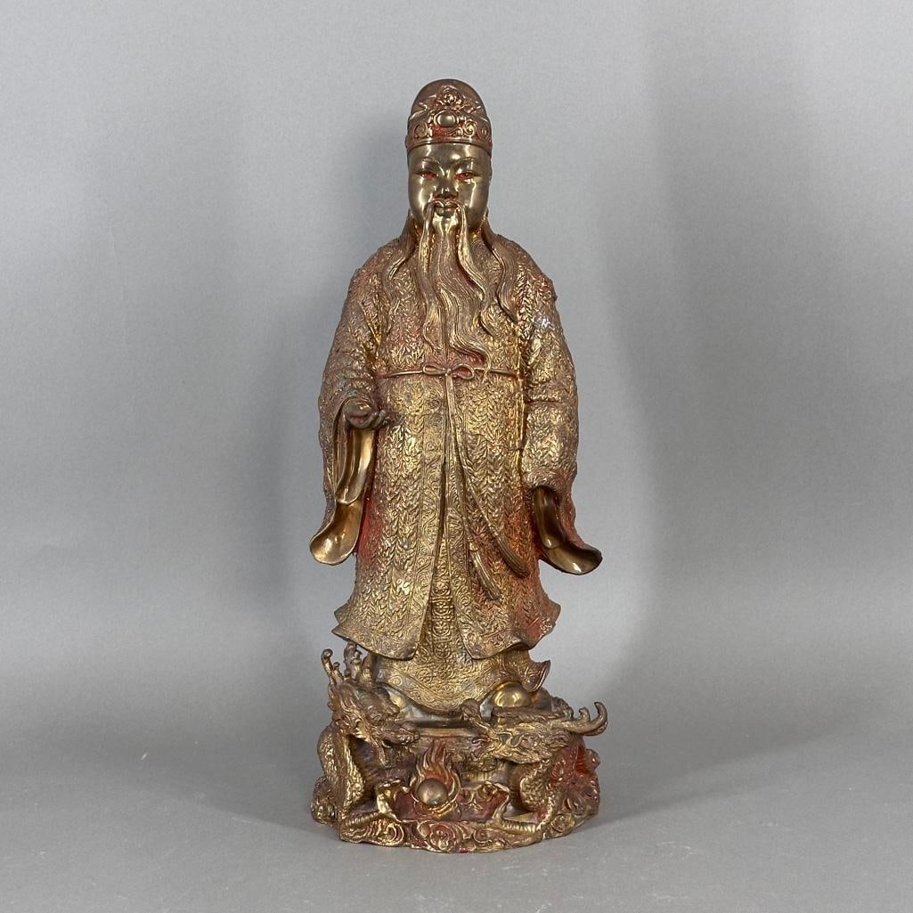 Chinese Bronze Deity with Dragons: Bronze with gold patina, male deity standing on cloud base with opposing dragons. Hollow base, no marks.