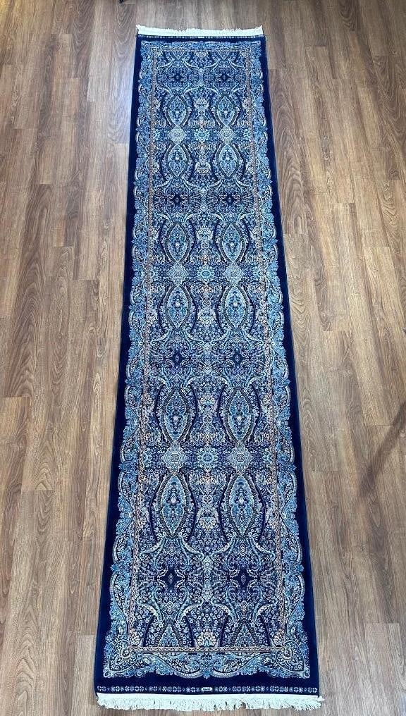 Turkish All Silk Runner 11'10" x 2'6": Pure silk on silk weft, very plush ans soft, medium blue ground with dense design overall in colors of light blue, ivory and tan, knotted fringe ends. Machine made. Apprx 11'10" x 2'6".