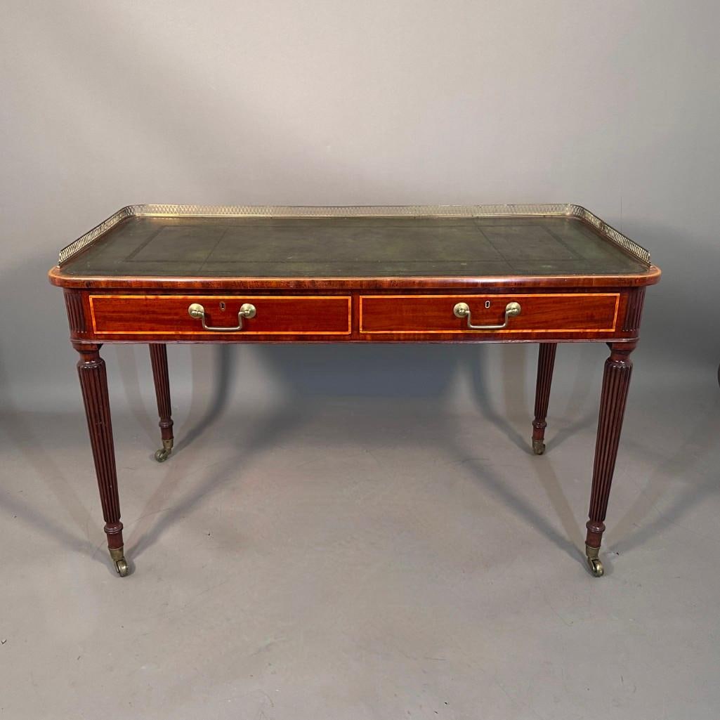 William IV Mahogany Writing Desk, c.1830: William IV Mahogany Writing Desk, c.1830, rectangular top with rounded ends, with brass pierced gallery over inset green tooled leather writing surface, with two frieze drawers in mahogany veneer with