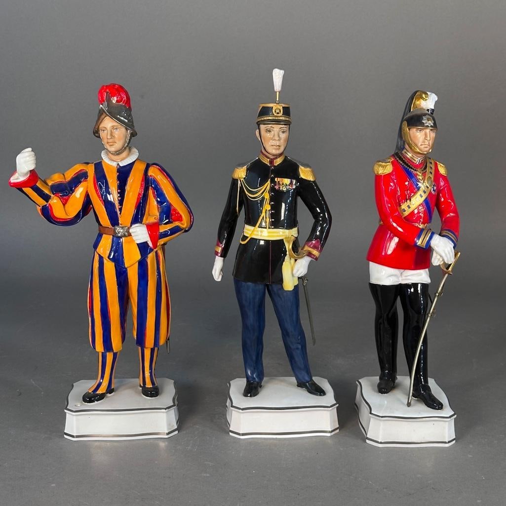 Three Royal Worcester Guards from the "Papal Series": Three bone china guards from the Papal series, by Royal Worcester, including Colonel of the Noble Guard in Gala Uniform, modeled by Neal French; number 101, apprx 11.5"T; Officer of the Palatine