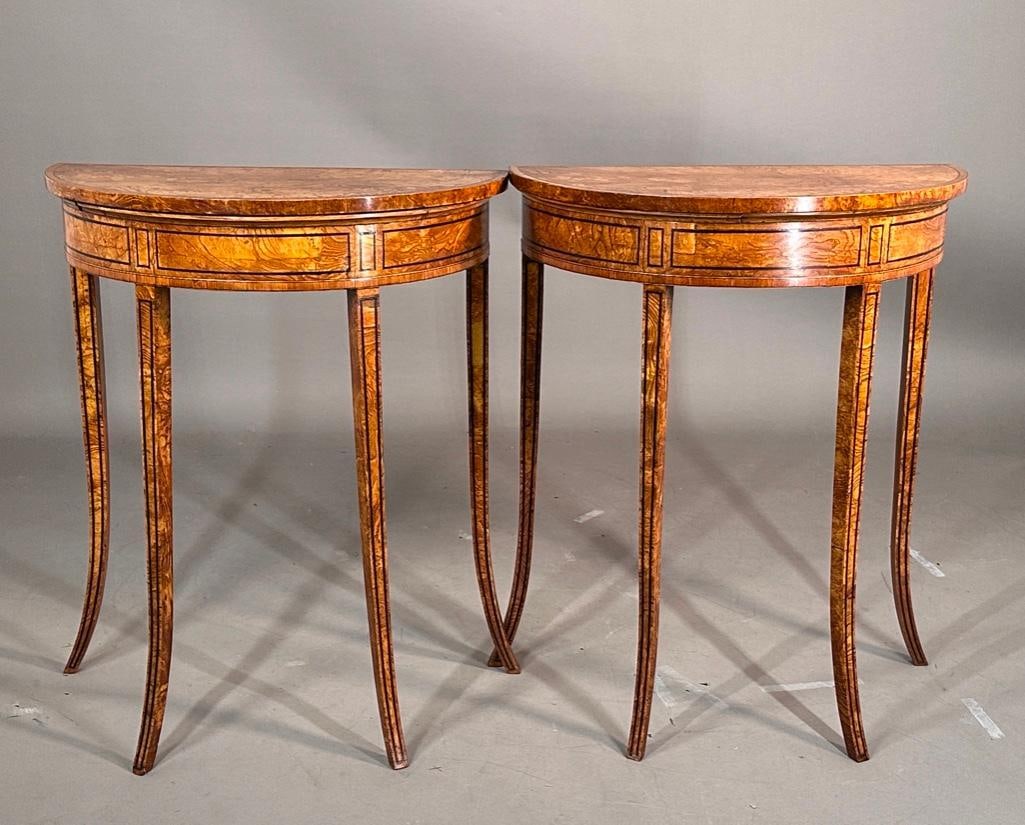 Pair of English Burlwood Demilune Console Tables, 19thc.: Pair of Burlwood Demilune Console Tables, 19thc. Probably English, demilune top with line inlaid banded border enclosing the figured wood top, over a banded frieze, raised on delicate squared line