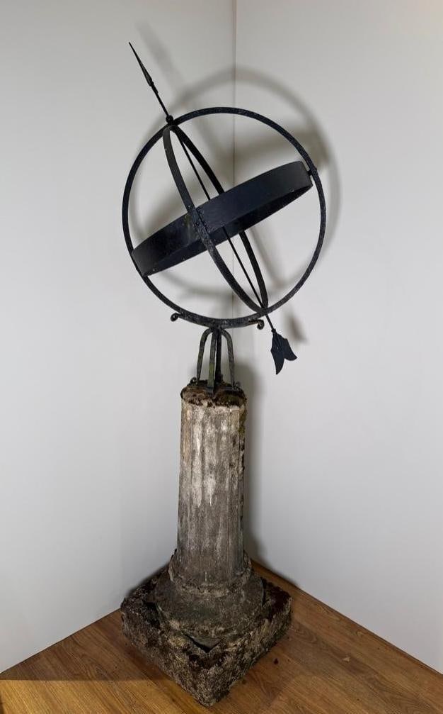Antique Armillary Sphere on Cast Stone Fluted Column and Base: Antique Armillary Sphere on Cast Stone Fluted Column and Base, the black painted armillary sphere resting on a classical fluted column and squared base. Dimensions: 71 in. h. x 19 in.d. Condition: As 