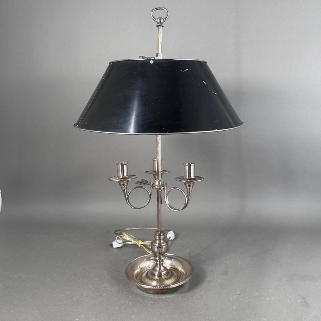 Silvered Bronze Bouillotte Lamp: Silvered Bronze Bouillotte Lamp, with tole peinte shade silvered to the interior, adjusting on a squared standard, with three lights in the form of French Horns, on an urn form base and circular dish