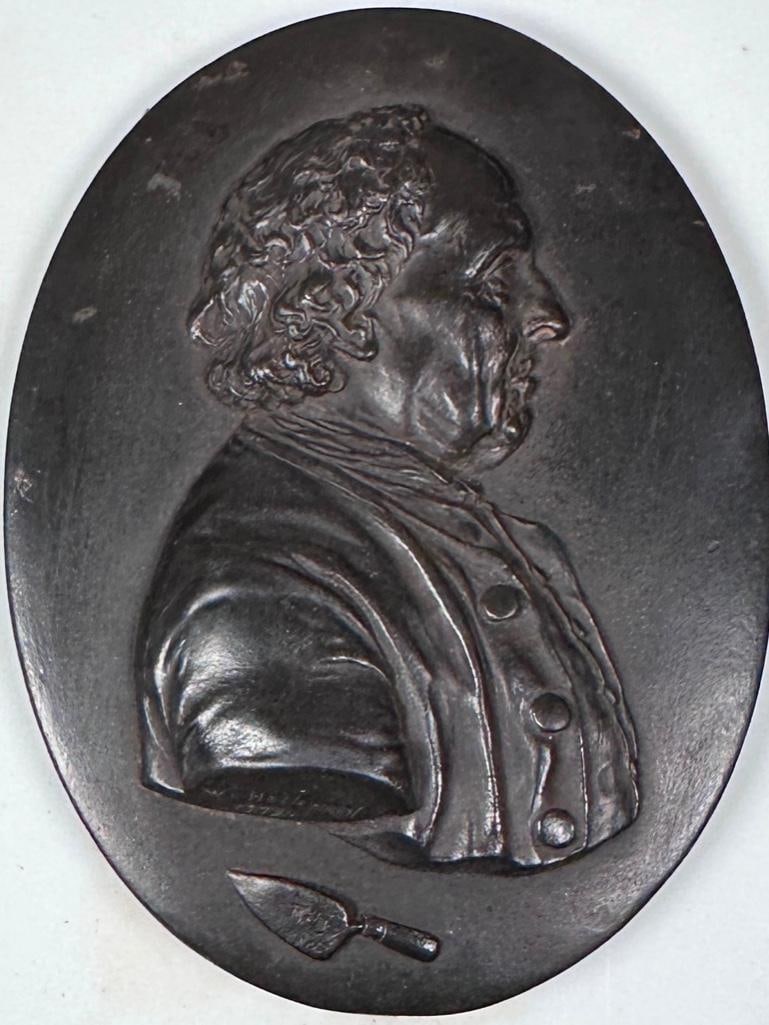 Wedgwood Black Basalt Portrait Medallion of Edward Bourne by William Hackwood, 1779: Wedgwood Black Basalt Portrait Medallion of Edward Bourne by William Hackwood, (Wedgwood Modeller, c.1757-1839) a bust length profile portrait of Wedgwood's bricklayer, signed and dated by