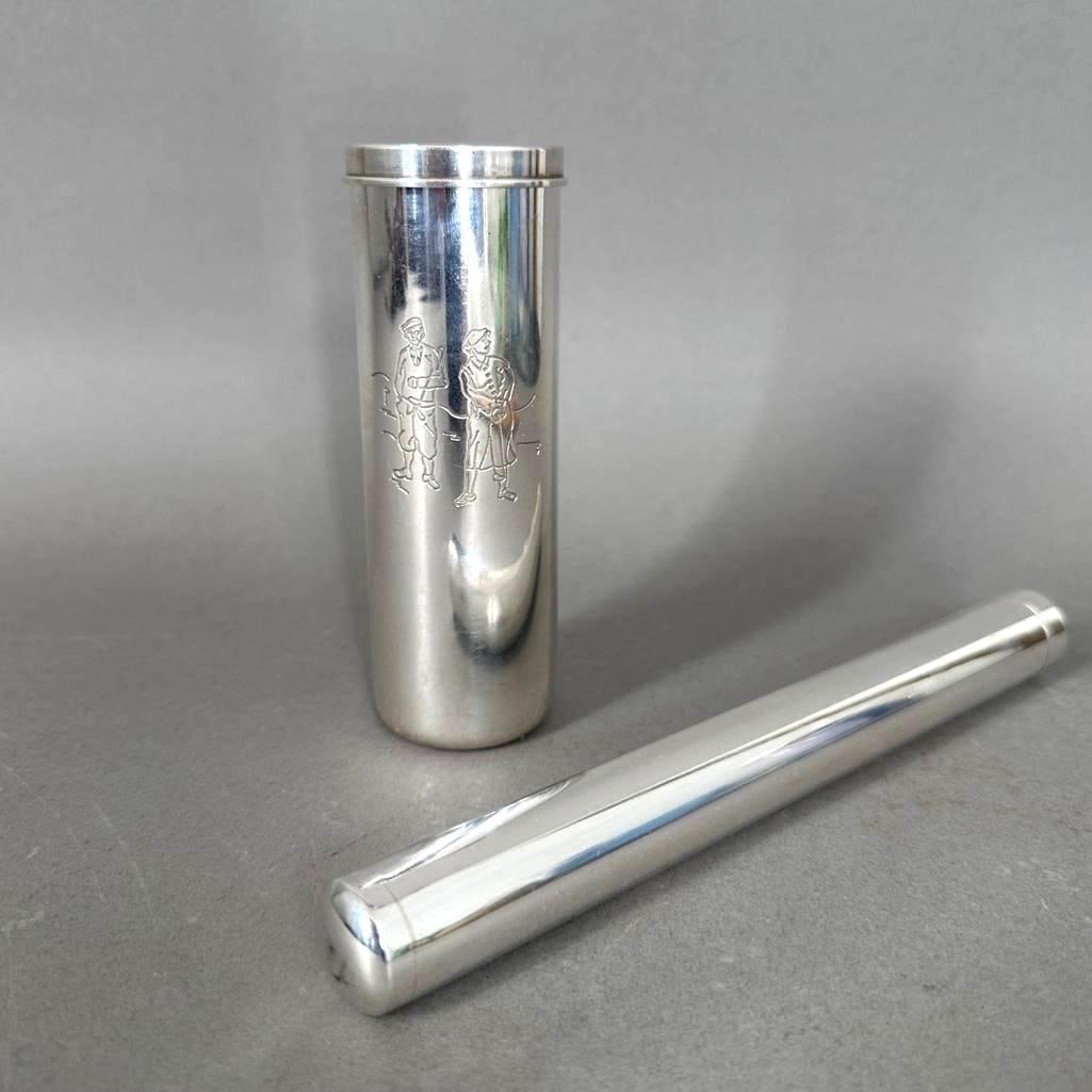 Two Sterling Silver Cigar Holders, Tiffany & Co. and Another: Two Sterling Silver Cigar Holders, Tiffany & Co. and Another. A Tiffany and Company Cylindrical sterling silver cigar holder engraved to the front with a pair of c.1900 golfers, stamped Tiffany &a