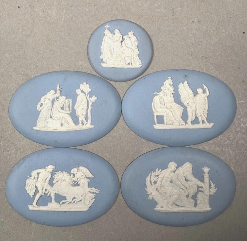 Five Small Loose Wedgwood Light Blue Jasper Medallions: Five Small Loose Wedgwood Light Blue Jasper Medallions, various classical , impressed Wedgwood Made in England. Dimensions: Largest 1.75 x 2.5 in. Condition: Very good with no damage or restoration.