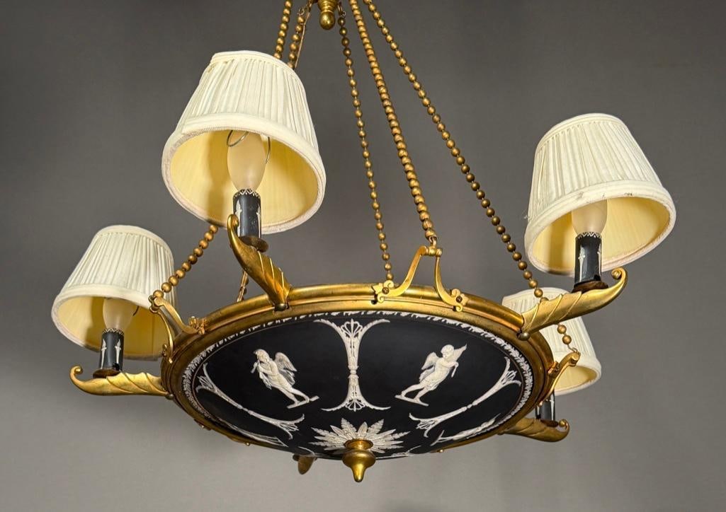 Wedgwood Jasperware Black Five Light Chandelier: Wedgwood Jasperware Black Five Light Chandelier, gilt bronze armature inset with a black and white jasperware plaffonier shade, decorated with winged cupids and palmettes, with bronze arms supporting 