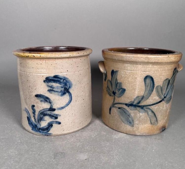 Two Cobalt Flora Decorated Crocks, Late 19th Century: Two slightly tapered cylindrical crocks with free-hand cobalt blue painting of flowers. Both with tooled band, one with applied handles, both with well formed lip and squared rims, apprx 7.5"H eac