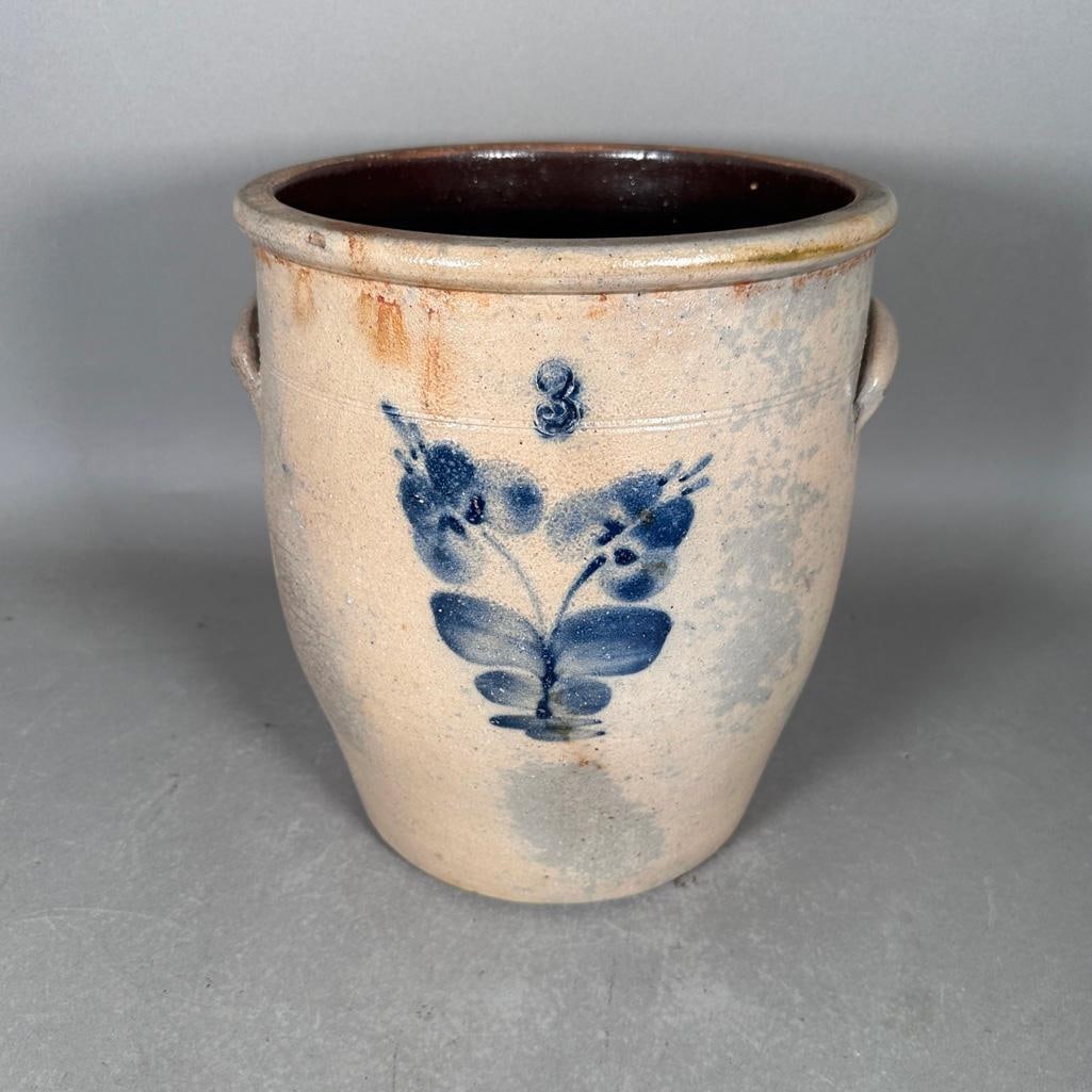 Cobalt Flower Decorated Salt Glazed Crock, 19th Century: Semi-ovoid form, applied lug handles, two tooled bands, well formed lip with squared rim, front freehand painted in blue cobalt of a two bloom flower under an impress 3 picked in cobalt, apprx