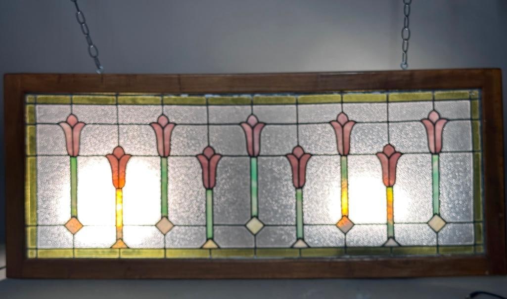 Leaded Glass Transom Window: Leaded Glass Transom Window, rectangular form window in pine frame, decorated with budding flowers in striated purple and green on a textured clear translucent ground, with olive green border. Dimensi