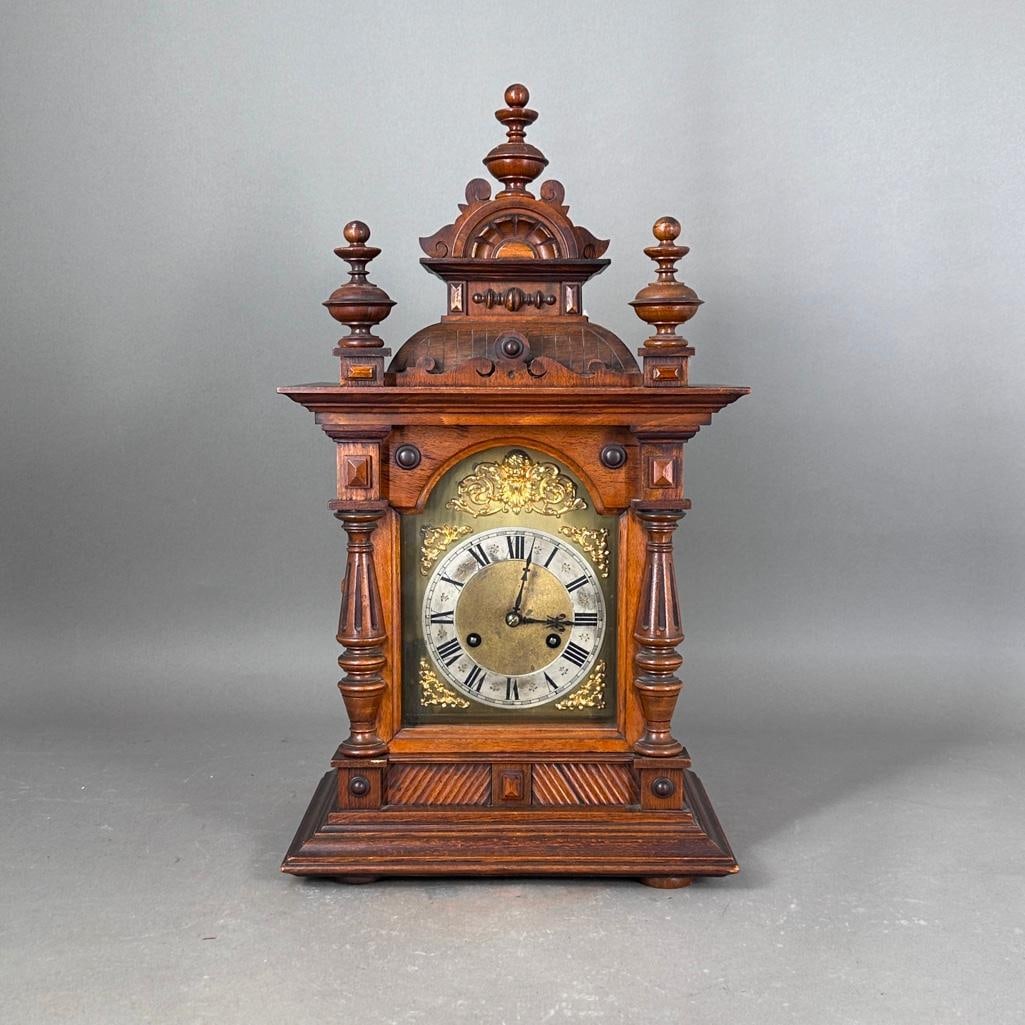 Antique Junghans Chime Clock, ca. 1900: Possibly German, walnut mantel clock, Roman numerals, brass decorations, on a silvered dial, 8 day striking movement, possibly Junghans with a glass front door and ornamental carved crown, with a two 