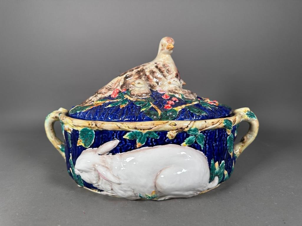 Italian Majolica Rabbit Tureen: Molded ceramic tureen with lid, cobalt blue glaze with other colors, high fired finish, apprx 12"T x 11"L x 12"W. The lid is topped with a nesting game bird and chicks.Vine handles. Design
