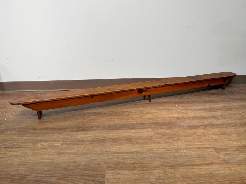 Antique Pine Kneeling Bench: Constructed of pine, three U shaped feet and top plank with curved ends; apprx 6"H x 7'L x 6"w. Family size. Condition: surface wear