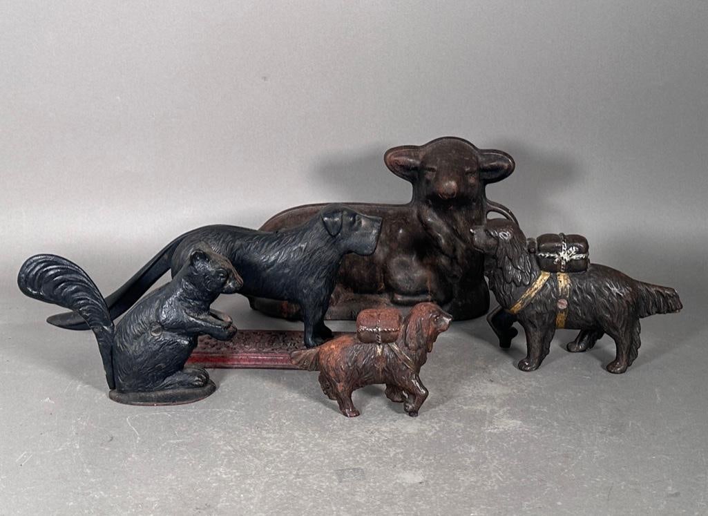 Cast Iron Dogs, Squirrel and Lamb: Five various cast iron items including two banks, two nut crackers and one mold. All antique pieces, some with hints of old paint, great as a group or individually to decorate. The lamb is the largest