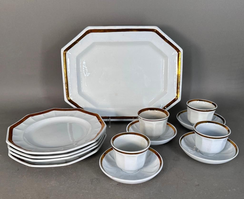 Ironstone China, Partial Service for Four by Livesley Powell & Co, ca. 1851-1865: Pre-Civil War. Lot includes a 15" x 11" octagonal serving platter, four 10"D matching plates, four 6"D saucers and four 3"T cups. Hallmarked on the bottom of the larger items, all 