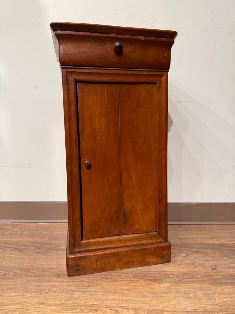 Walnut Bedside Cabinet, late 19th century: Warm honey color cabinet with single front door; the interior with one notched shelf, one dove-tailed drawer with wood knobs, flat panel base, apprx 32"H x 16.5"W x 14"D. Condition: small 