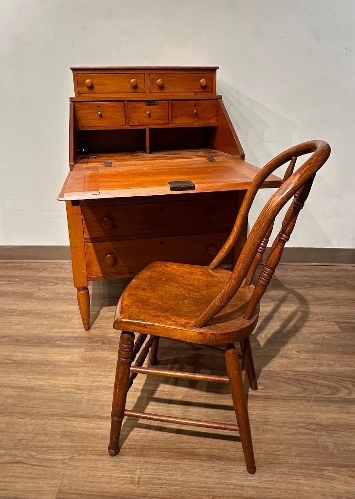 Rustic Antique Pine Desk, with chair: Golden color pine utility desk with drop front on a butcher's block type base with two drawers, round knob pulls, two upper drawers over container desk area with hidden compartment and many