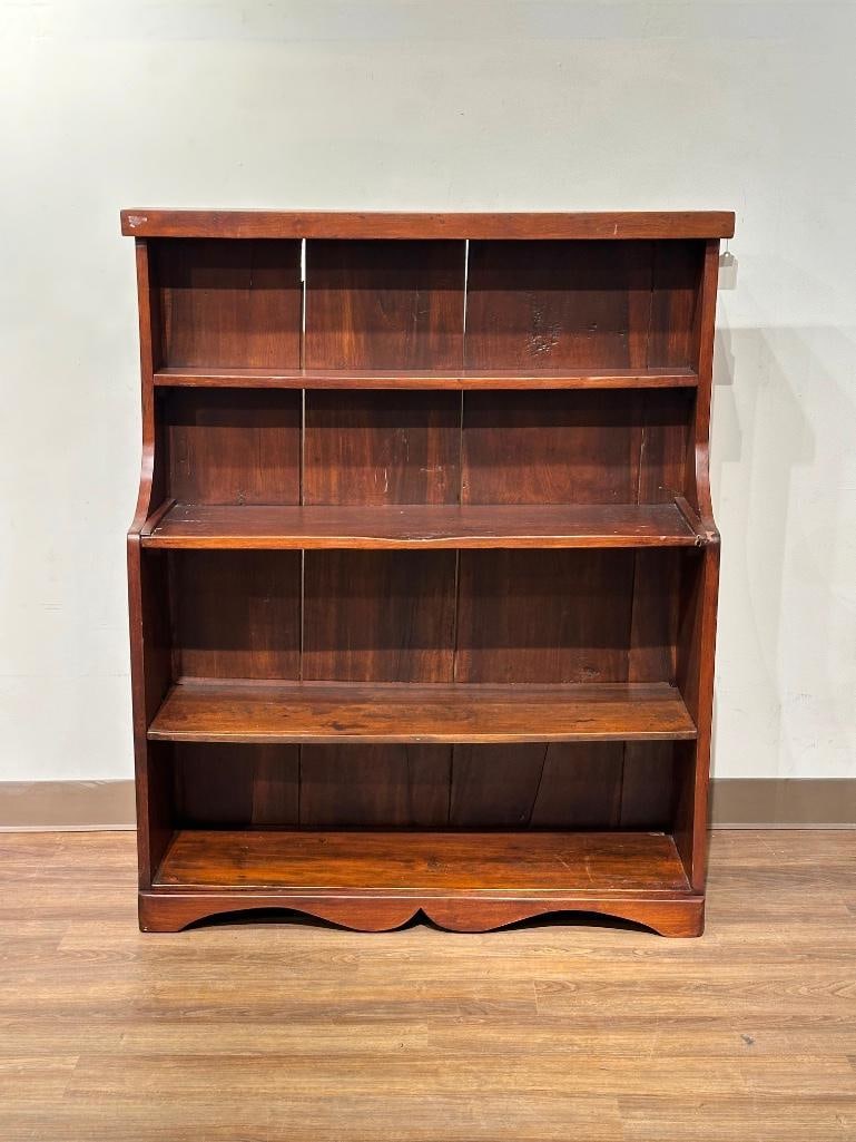 Antique Pine Step-back Display Cabinet: Stained and refinished step-back cabinet with three deep shelves and one smaller upper shelf, carved front apron, apprx 51.5"T x 42"W x 12"D. Condition: areas of chipped finish throughout,