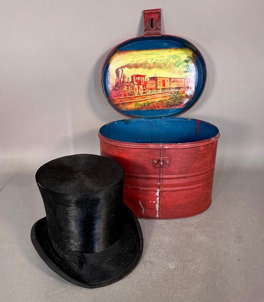 Brushed Beaver Top Hat with Case, mid 19th century: Manufactured by George Hook Jr., & Bro., Allegheny PA. Black with up-turned rim at sides with black silk bow, offered in red painted metal case. Interior opening is 6.5" x 7.5". Hat is