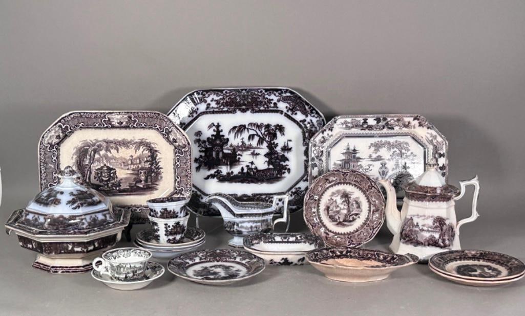 Collection of Black Transferware Ironstone, English, 19th century: An assembled collection of mostly Pagoda design, with a few Classical landscape design pieces as well; 8"H octagonal lidded tureen with one handle missing; 8.5"H lidded teapot with landscape o