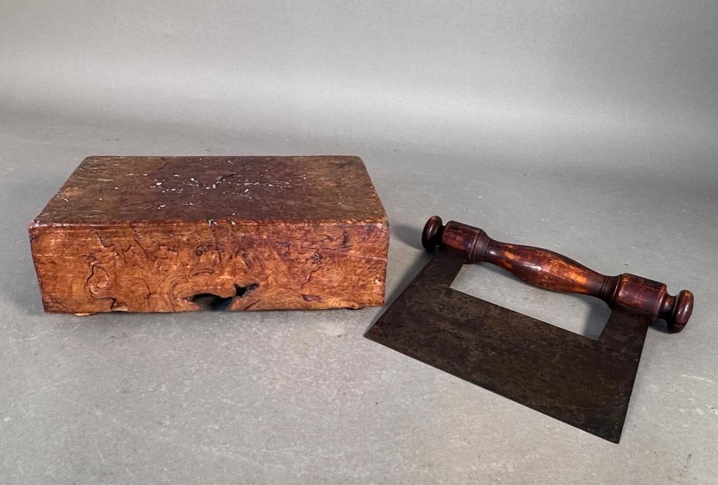 Burlwood Chopping Block and Antique Herb Chopper: A block of burlwood, raised on cork feet, with lots of wear from use. Apprx 9.5 x 5.75 x 3 in. Herb chopper with turned wood handle and metal blade, 9 x 7 in. Condition; worn, as expected.