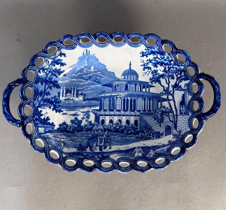 Attributed Cambrian Pottery, Blue Transfer India View Chesnut Basket, early 19th century: Blue transfer Chalees Satoon scene on a chestnut basket raised on open-worked base with handles, depicting the fort of Allahabad on the River Jumna pattern. Underside has printed "1".