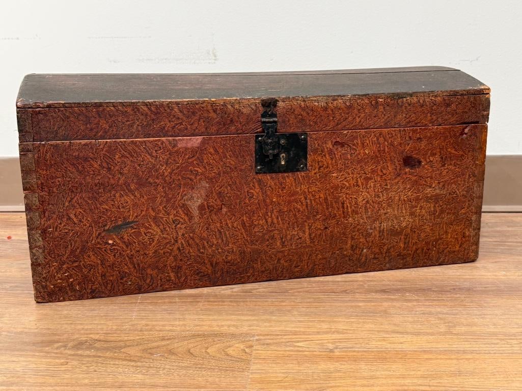 Faux Burl Painted Wood Trunk: Pine wood, faux burl painted, dome hinged lid, metal lock (no key), dove tailed construction, 11.5 x 25.5 x 12.5 in. Condition: Lid has shrinkage with separations.