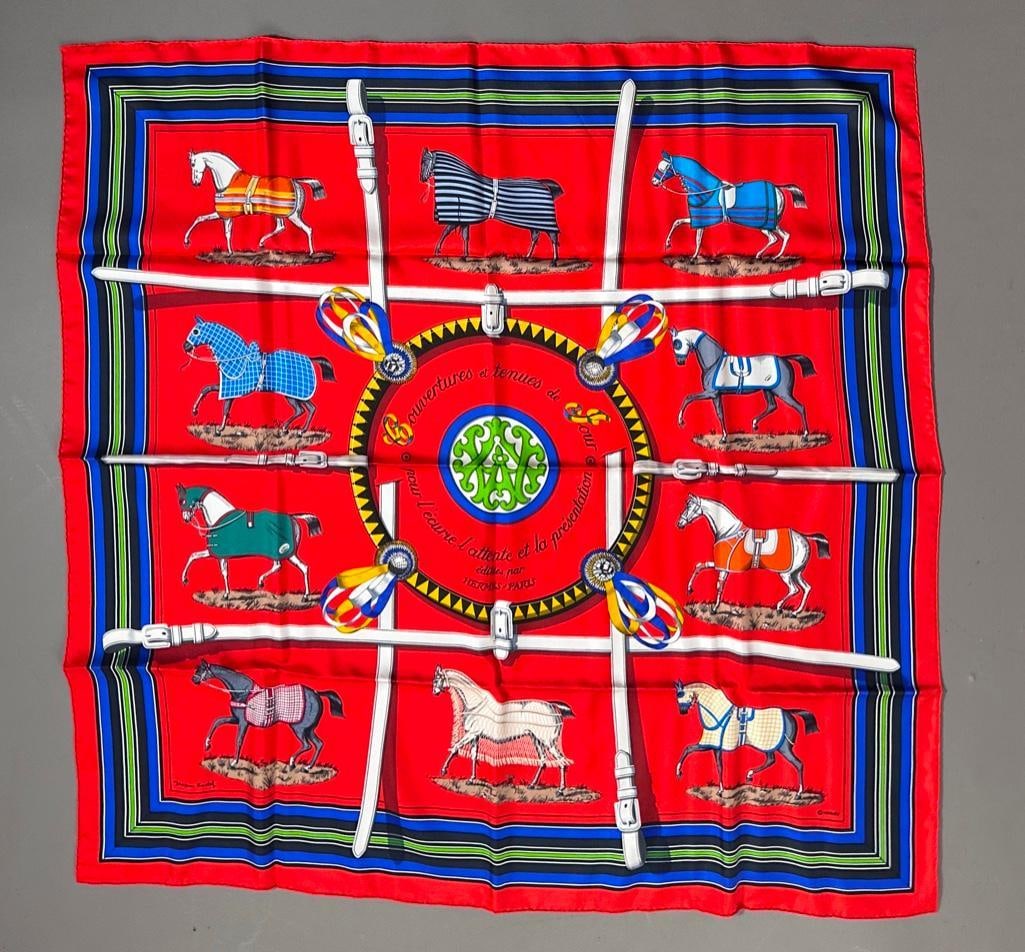 Hermes Silk Twill "Couvertures et Tenues de Jour" Scarf: Hermes Silk Twill "Couvertures et Tenues de Jour" Scarf, designed by Jacques Eudel, in red, gold, blue and cream, signed Hermes, Paris, with original tag, in original box. Dimensions: 34 x 34 in.