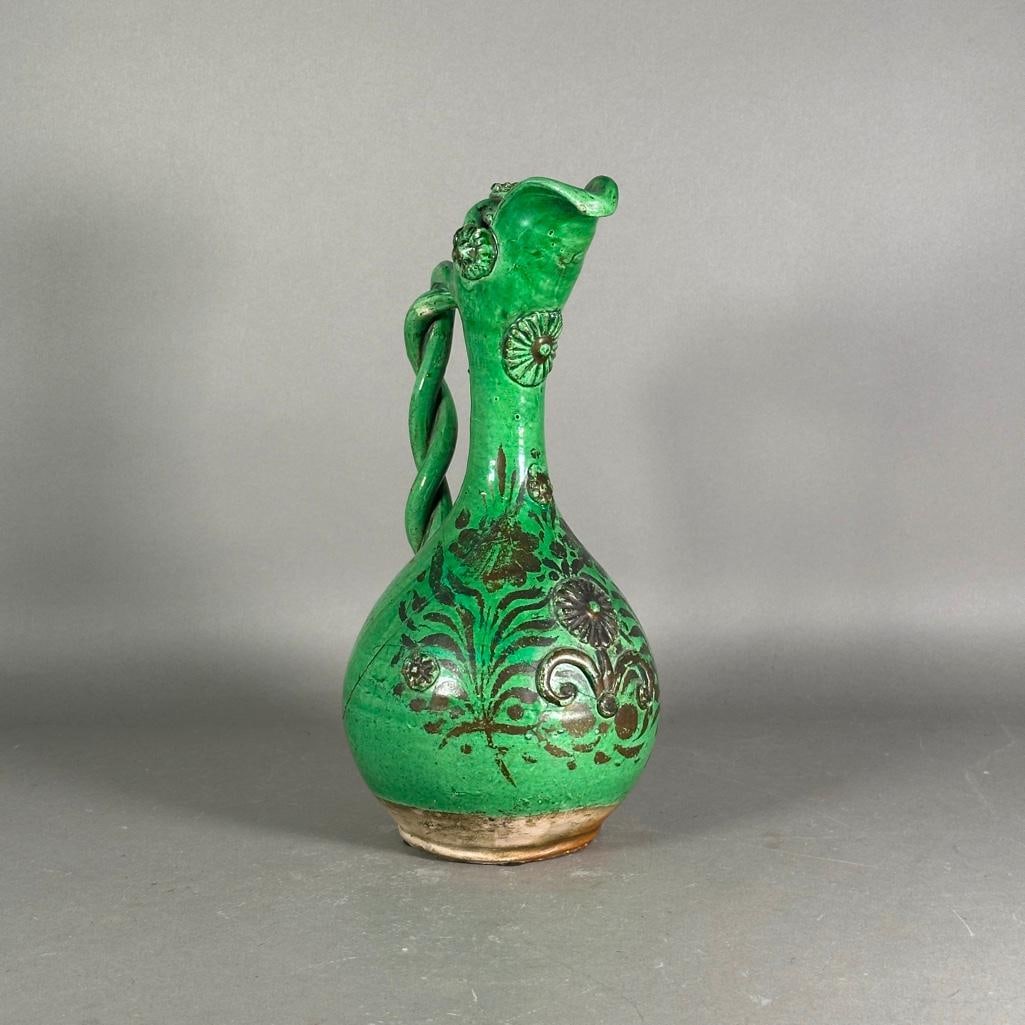 Turkish Canakkale Green Glazed Pottery Ewer: Turkish Canakkale Green Glazed Pottery Ewer, bulbous base with slender neck and everted spout, with applied twist handle, covered in green glaze, hand decorated with floral designs in brown glaze and 