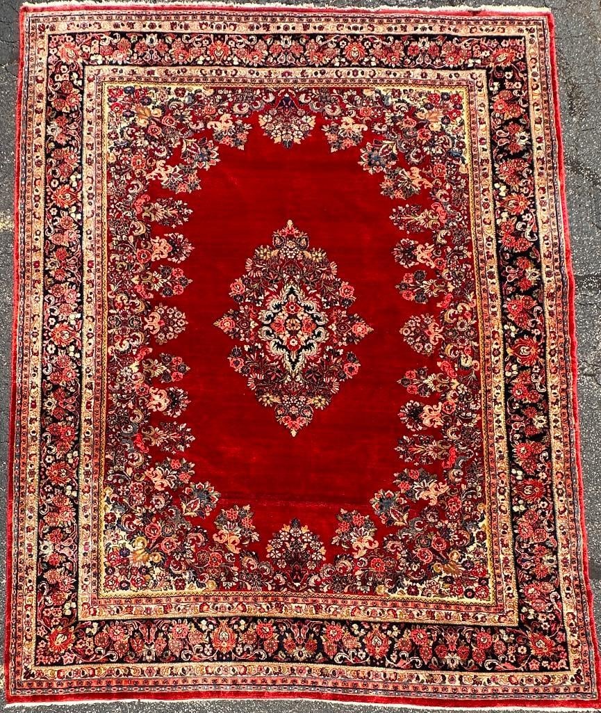 Vintage Persian Mashad Carpet 13'5" x 10'2": Medium wool pile on cotton weft with an elaborate Shah Abbasi medallion, filled with floral pendants, rosettes and tiny leaves. Open crimson field, with a floral border guard. Wide dark border with pa