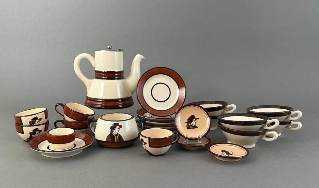 Quimper Faience Assorted Service: Quimper Faience Assorted Service, glazed in brown and white, decorated with male and female Breton profile portraits, comprising; teapot with metal cover and strainer, two handled sugar bowl, six tape