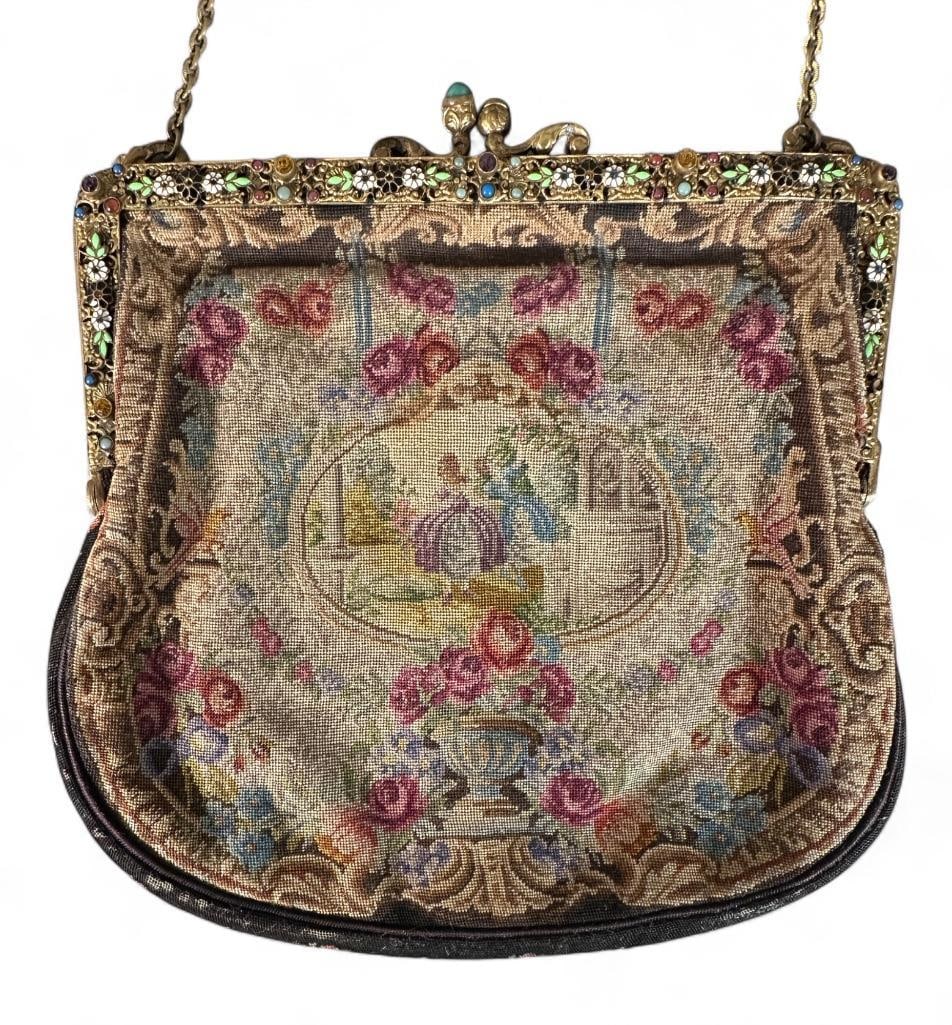 Antique Petitpoint Evening Bag: With metal frame and enameled flowers, Romantic scene in petitpoint with link chain. Silk interior. Dimensions: 7.25 x 7 in. Condition: very nice for age.