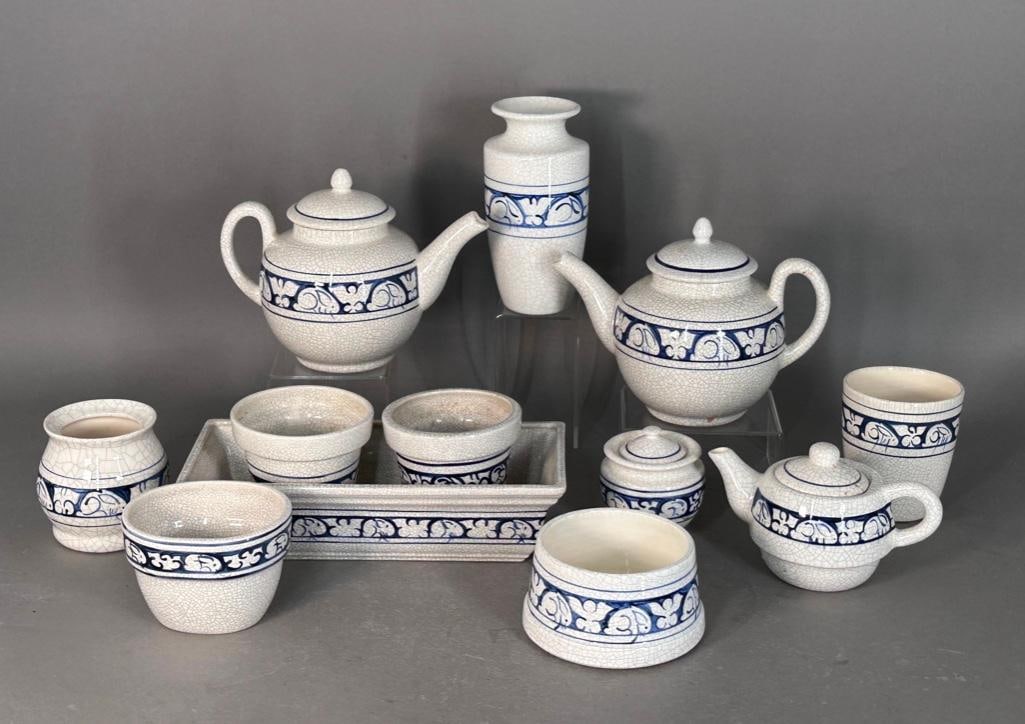 Rabbit Pottery, ca. 1982: Produced by The Potting Shed, after the original Dedham Pottery, featuring the classic Rabbit pattern, a signature motif of the Dedham. Low crouching rabbits in blue on a crackle-glaze cream color